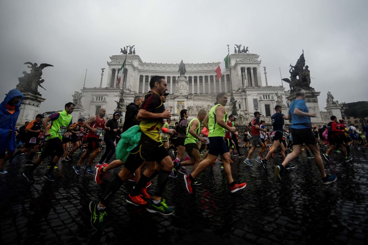 Competitors run past the Altare della Patria monument during the 25th edition of the Rome Marathon in April 2019.