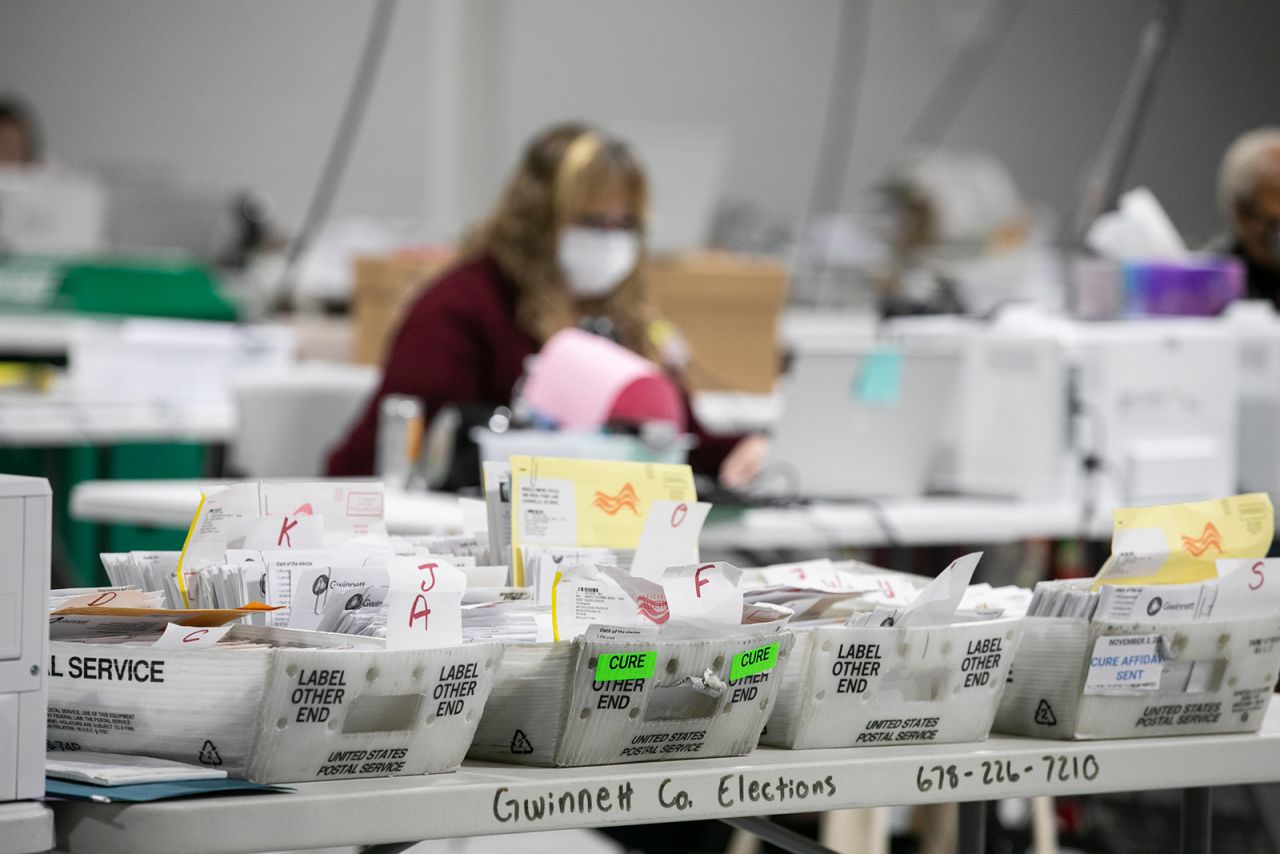 Gwinnett County workers continue to count absentee and provisional ballots at the Gwinnett Voter Registrations and Elections office on November 6, in Lawrenceville, Georgia.