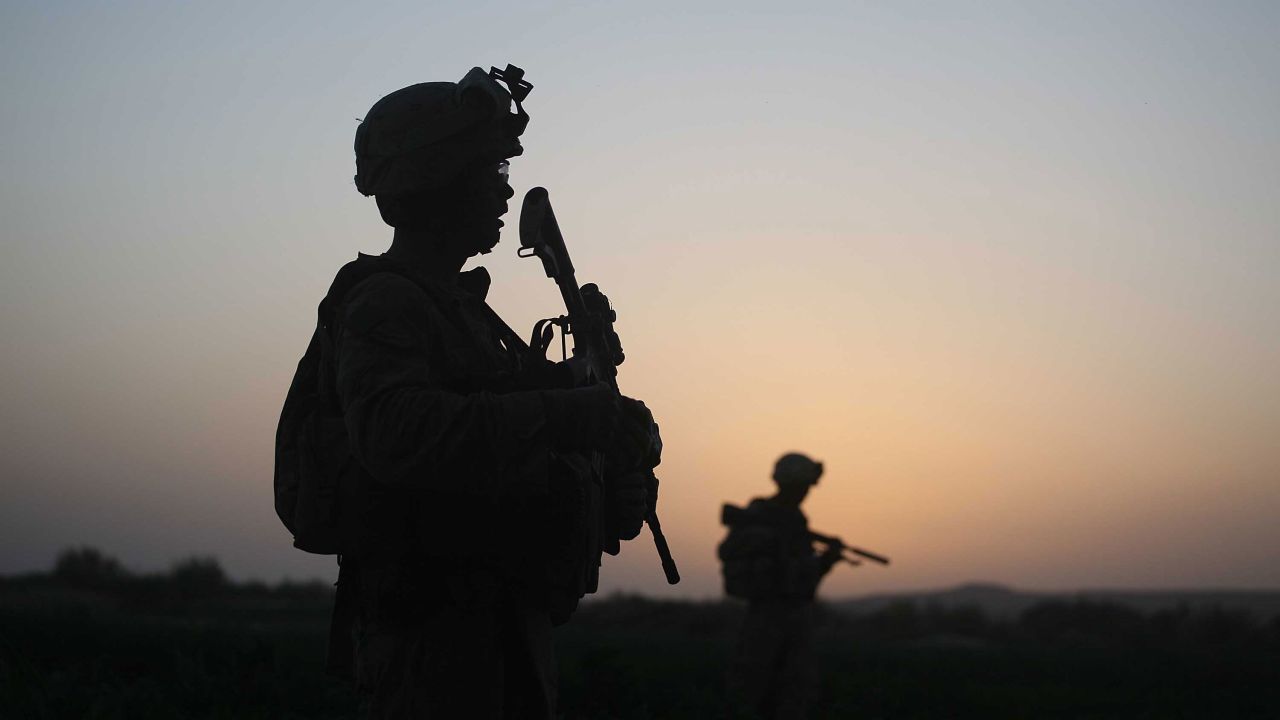 Silhouettes of US Marines are seen in 2009 in Herat, Afghanistan.