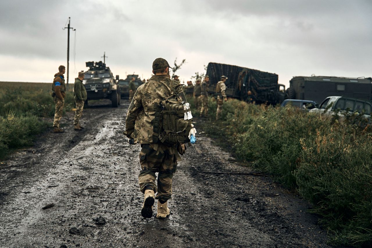 Ukrainian soldiers stand on a road in the Kharkiv region, Ukraine, on September 12.