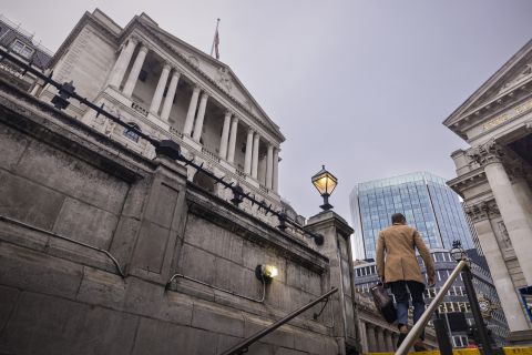 A morning commuter passes the Bank of England in the City of London, UK, on October 17.