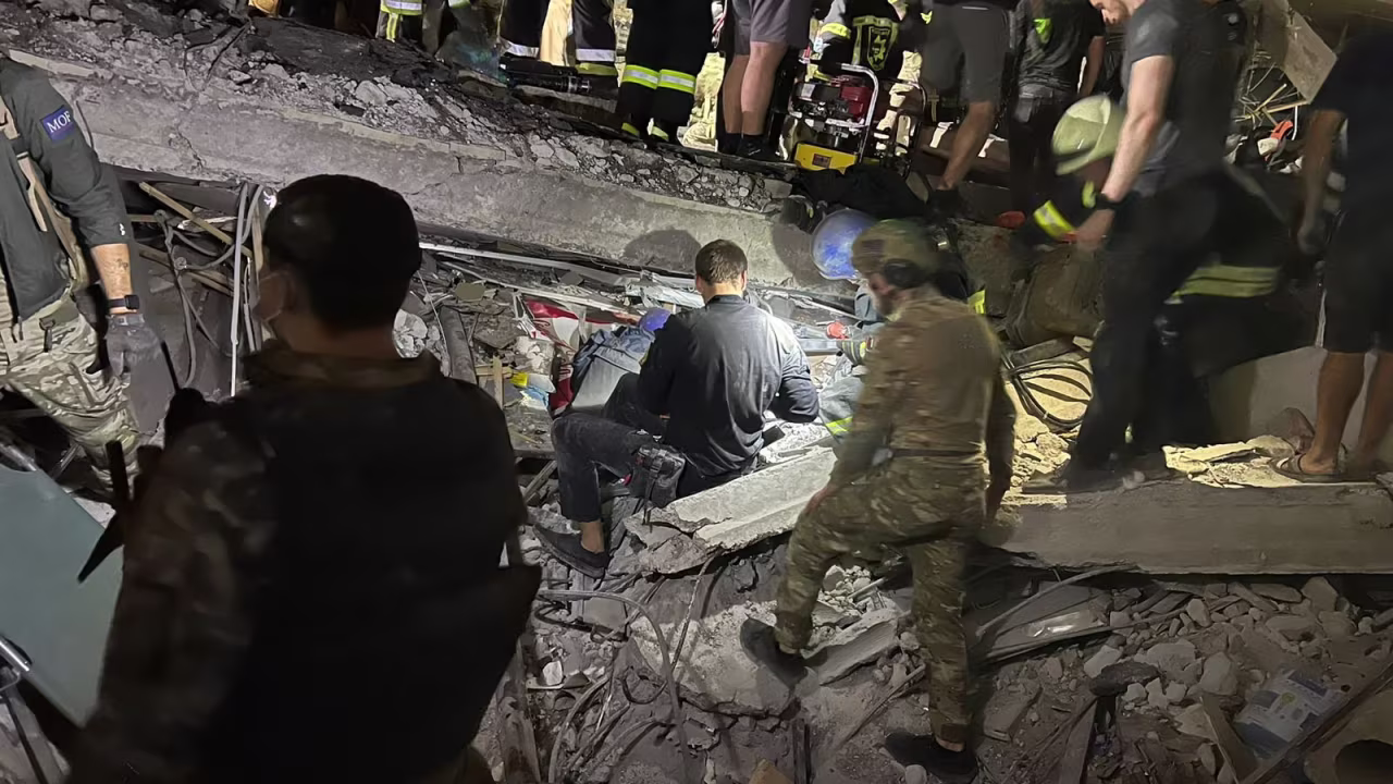 Emergency responders work to rescue survivors.