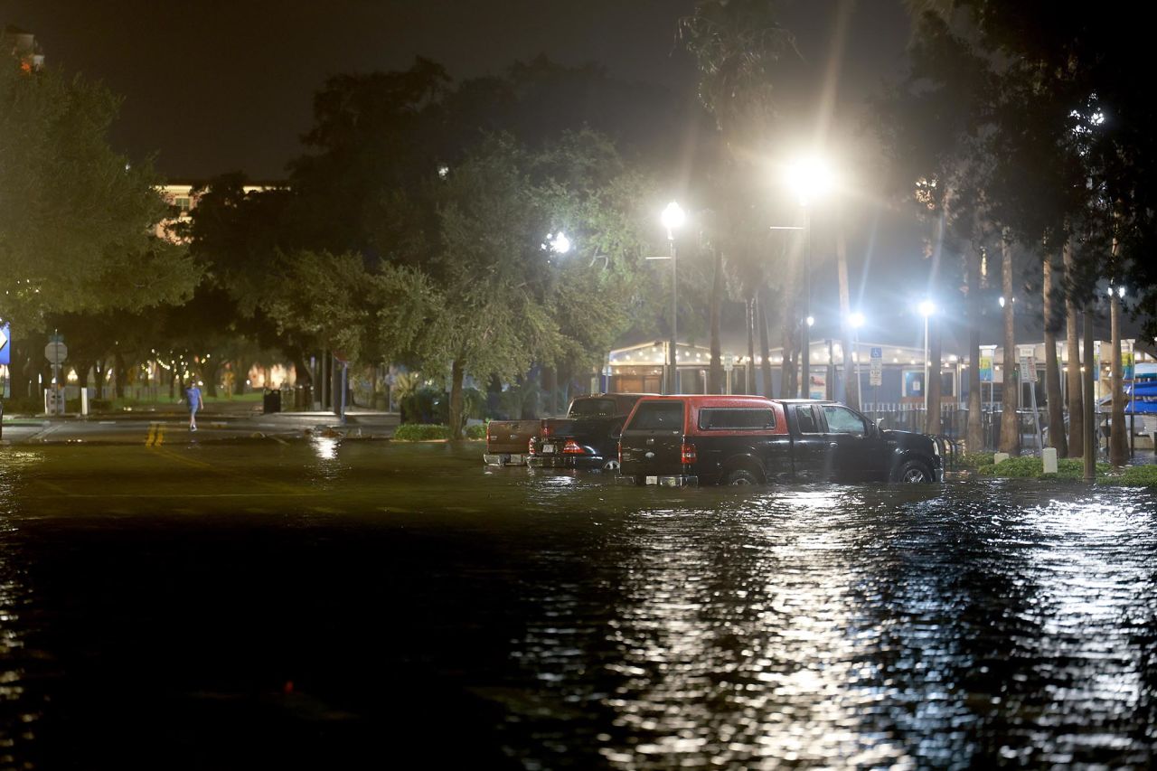 Vehicles sit in a flooded street caused by Hurricane Idalia passing offshore on August 30, in St. Petersburg, Florida. 