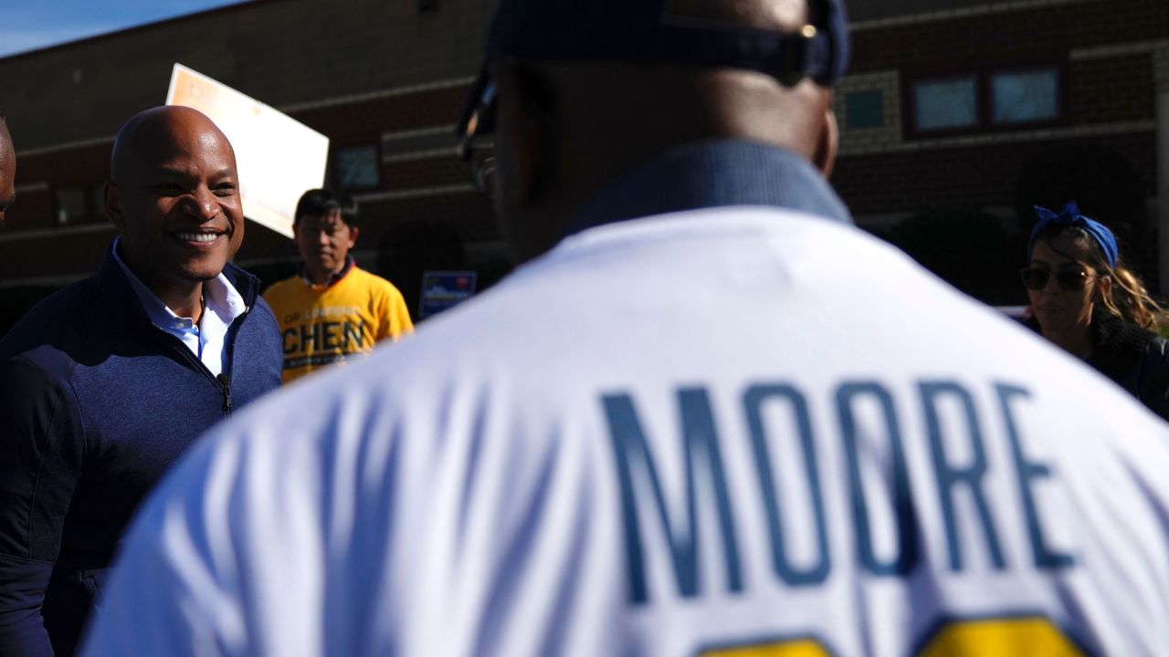 Moore speaks with a supporter during a campaign stop in Ellicott City on Tuesday.