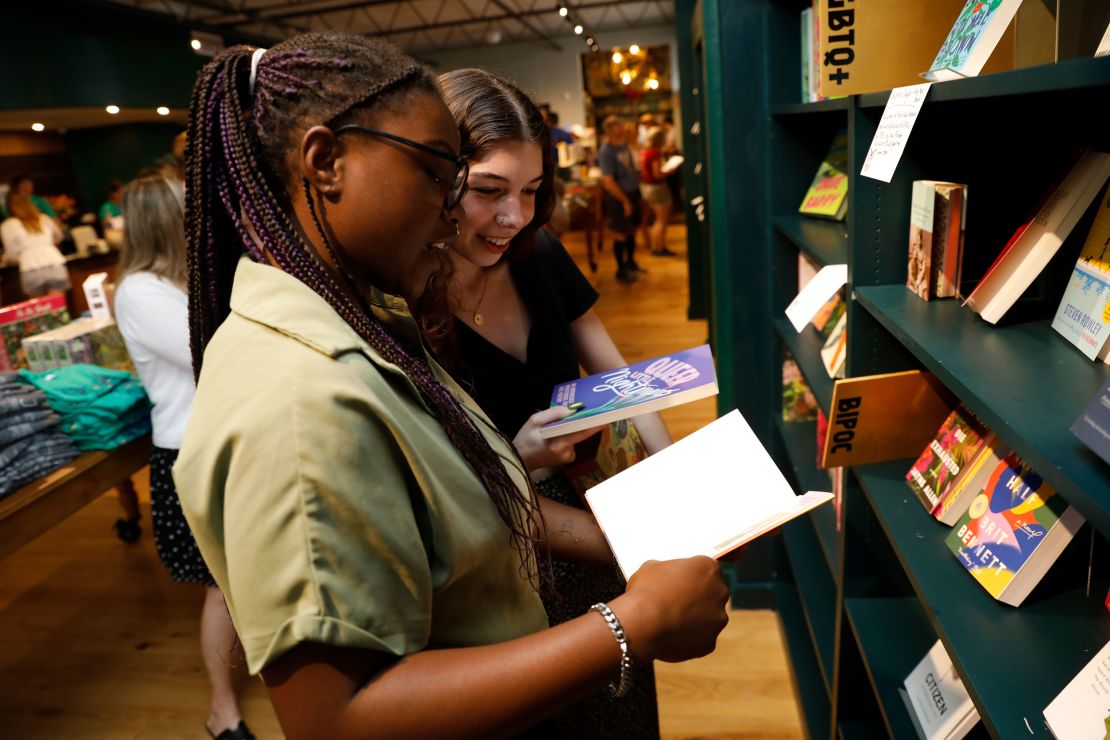 Palace Niekerk, left, and Emily Ayers browse through books by authors in the BIPOC and LGBTQ+ sections of the Lynx.