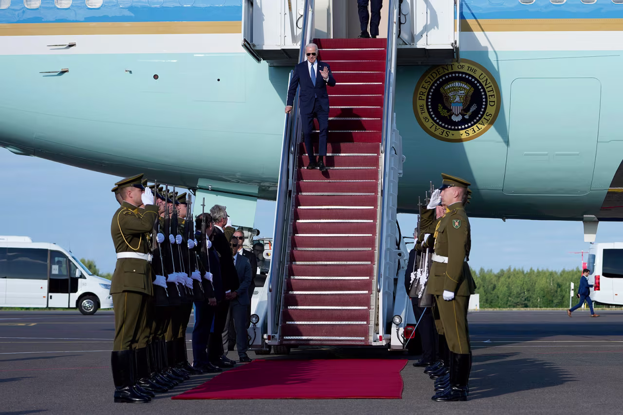 US President Joe Biden waves as he arrives in Vilnius, Lithuania, on Monday, July 10.
