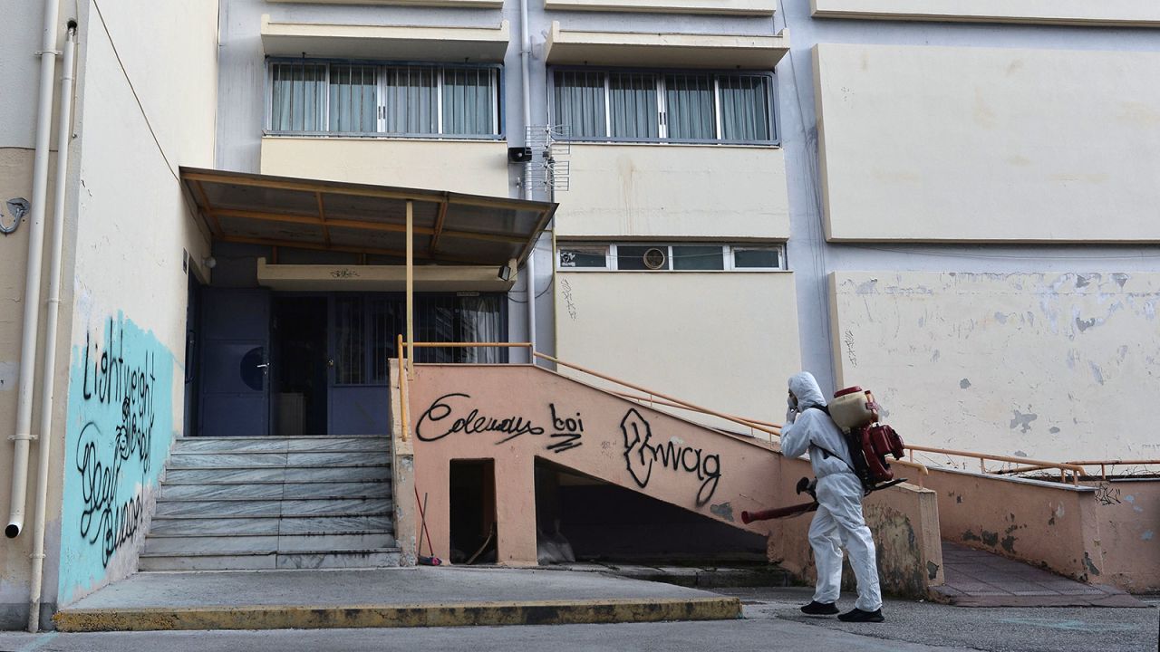 A worker sprays disinfectant as part of preventive measures against the spread of the COVID-19, the novel coronavirus, in a school in Thessaloniki, Greece on February 27.