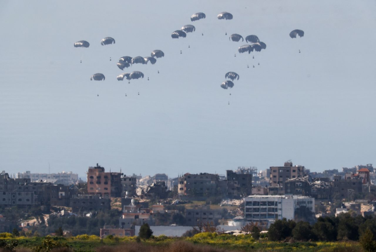 Packages fall towards?Gaza after being?dropped from a military aircraft as seen from southern Israel on March 5.