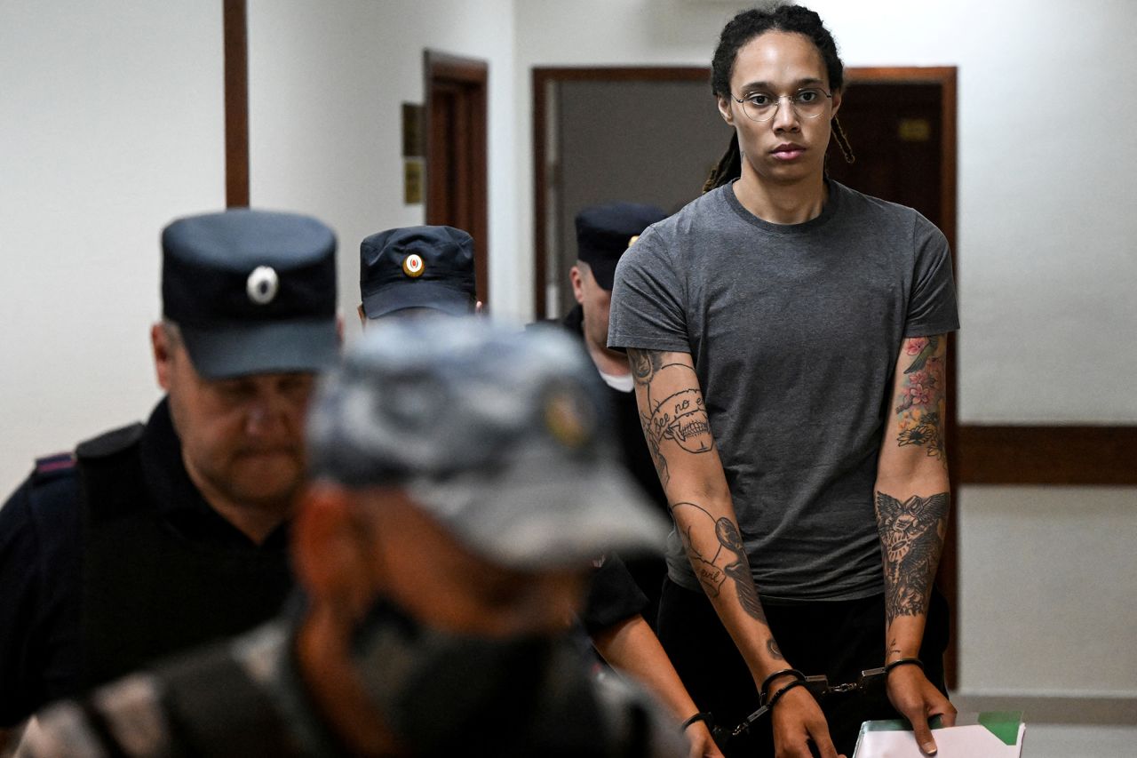 US basketball player Brittney Griner, who was detained at Moscow's Sheremetyevo airport and later charged with illegal possession of cannabis, is escorted in a court building in Khimki outside Moscow, Russia, on August 4.
