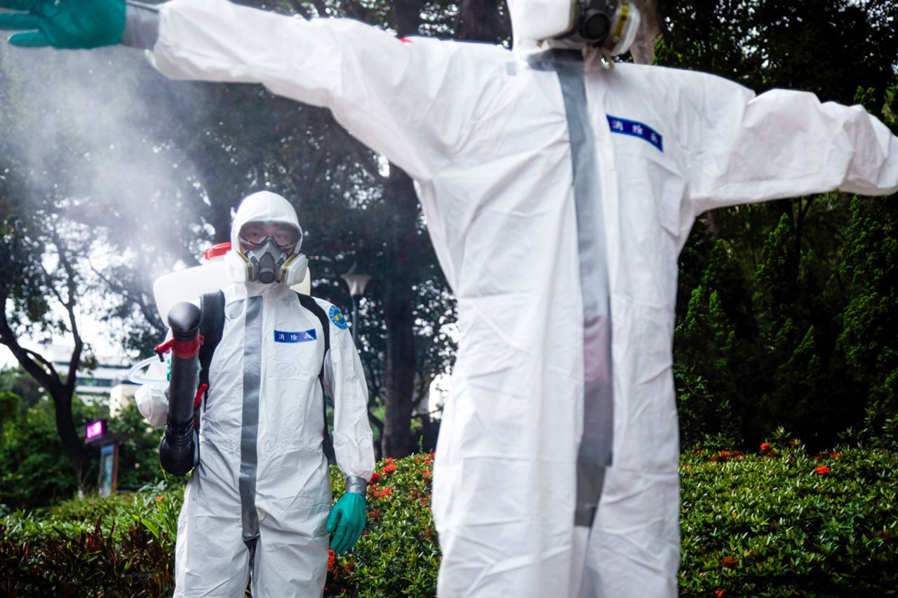 A soldier disinfects his fellow worker after a sanitization operation in Taipei, Taiwan on May 24.