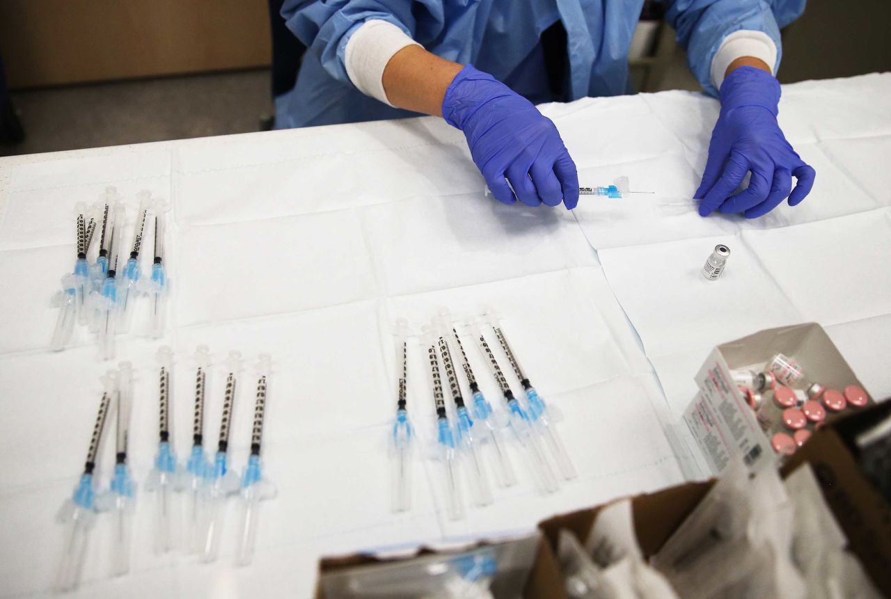 A pharmacy technician prepares a vaccine dose for a patient in Torrance, California, on January 21. 