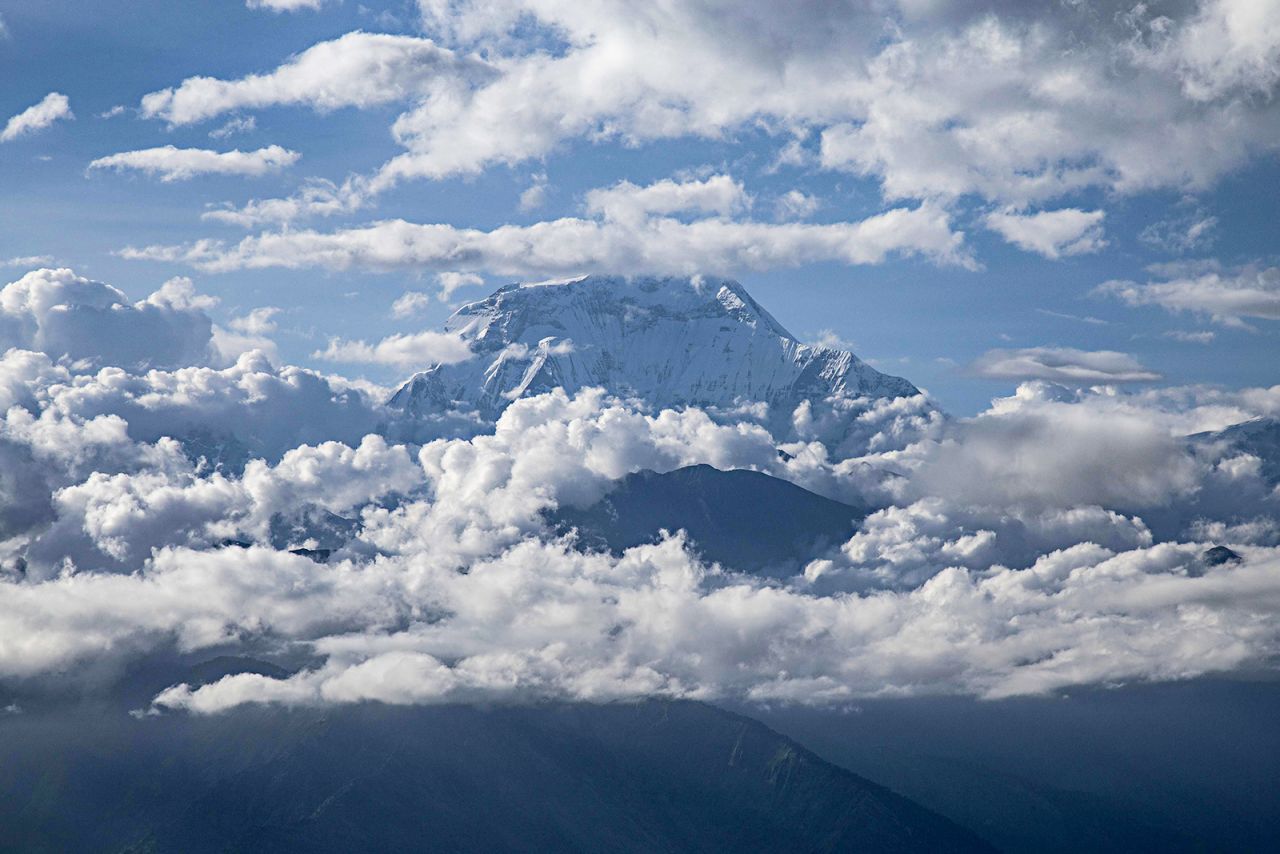 Mount Dhaulagiri is seen surrounded by clouds in Nepal, on August 22, 2019.