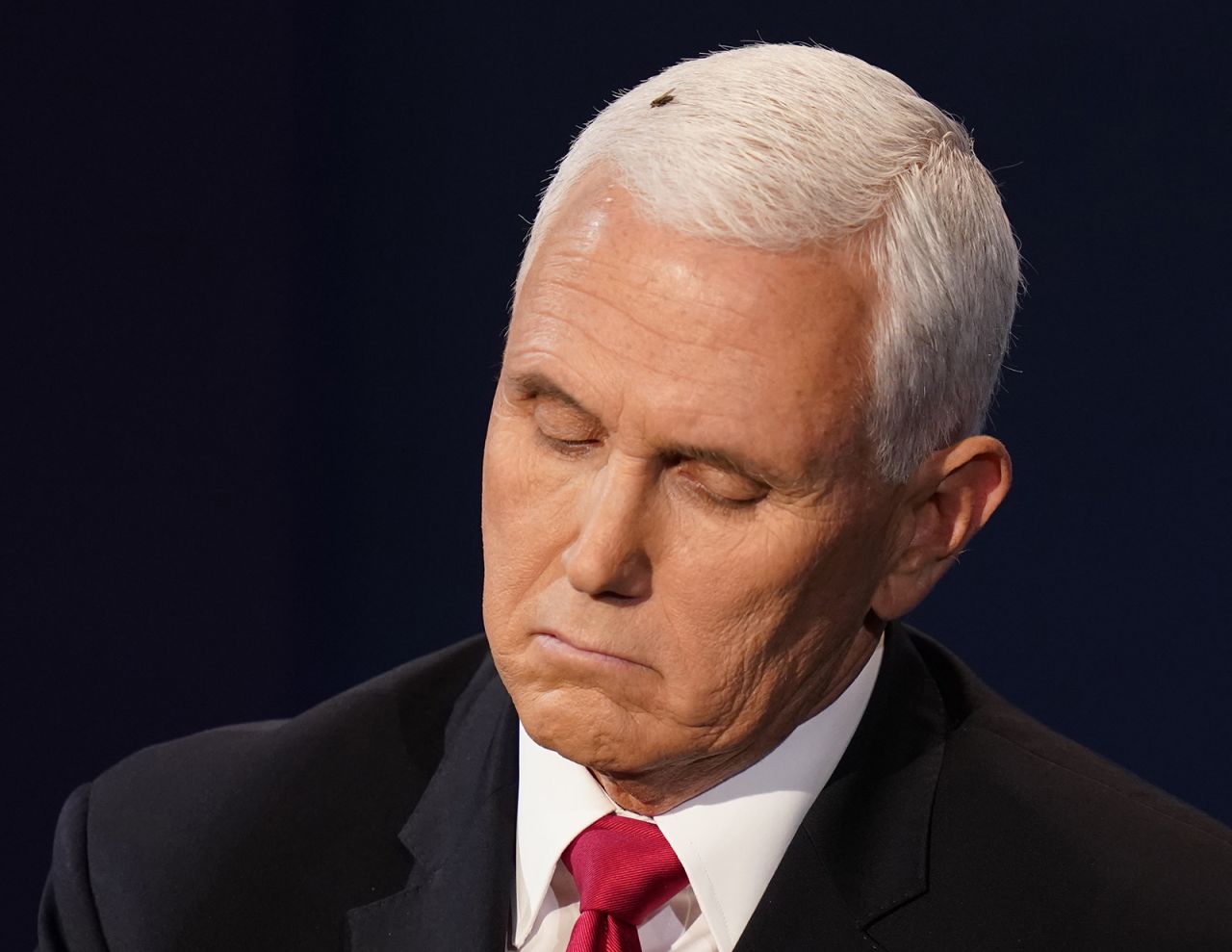 Vice President Mike Pence listens to Democratic vice presidential candidate Sen. Kamala Harris during the vice presidential debate on Wednesday in Salt Lake City.