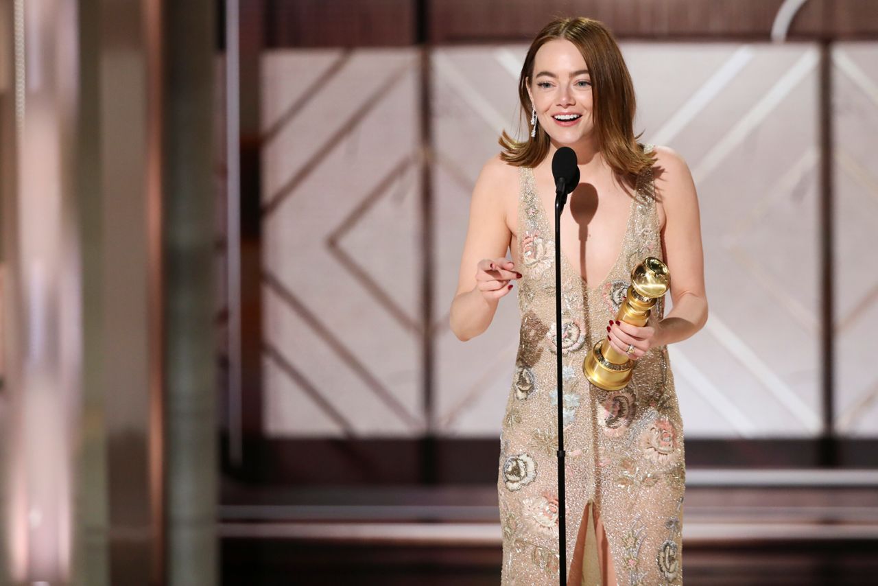 Emma Stone accepts her Golden Globe award. 