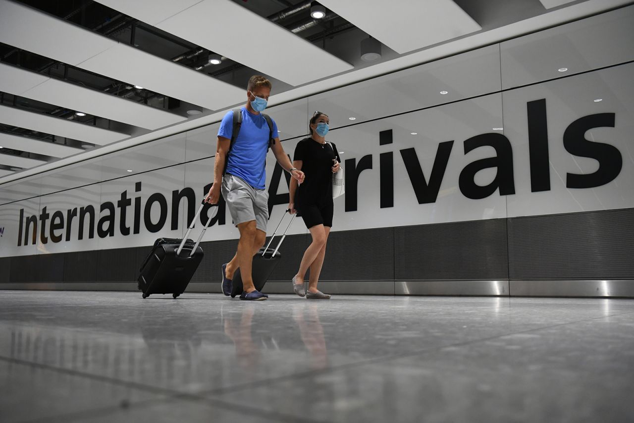 Passengers arrive at Heathrow Airport after a flight from Dubrovnik, Croatia, landed on August 21.