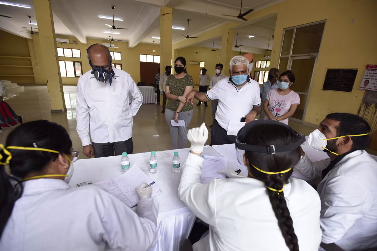 People register for coronavirus testing at a community center near the Huda Market, on July 18, in Gurugram, India. 
