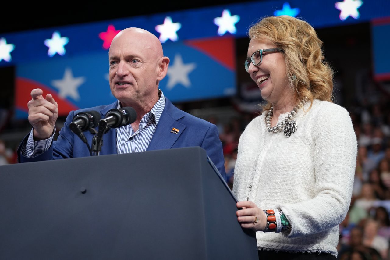 Sen. Mark Kelly and his wife former Rep. Gabby Giffords speak during a campaign rally for Kamala Harris and Tim Walz Glendale, Arizona, on August 9.