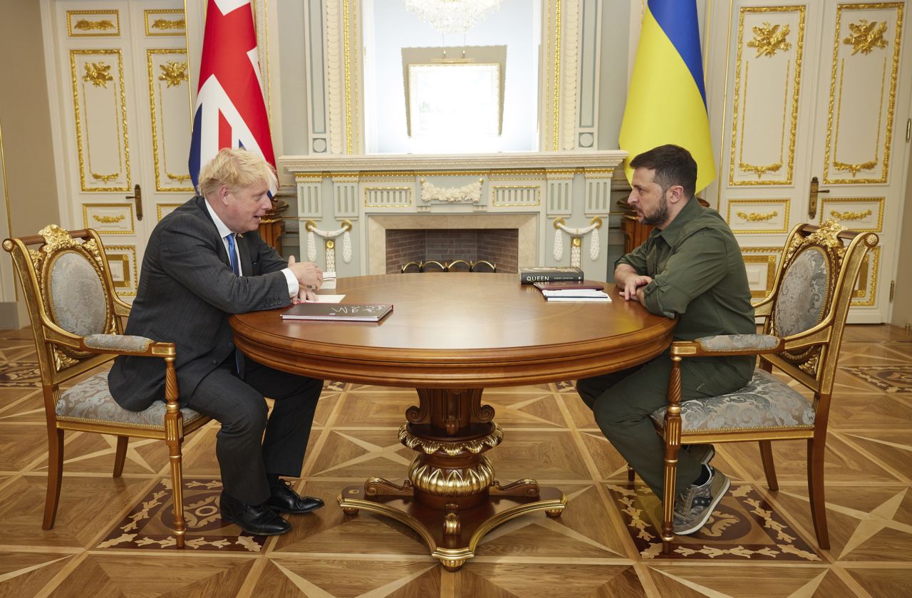 British Prime Minister Boris Johnson talks with Ukrainian President Volodymyr Zelensky during their meeting on Friday in Kyiv, Ukraine.
