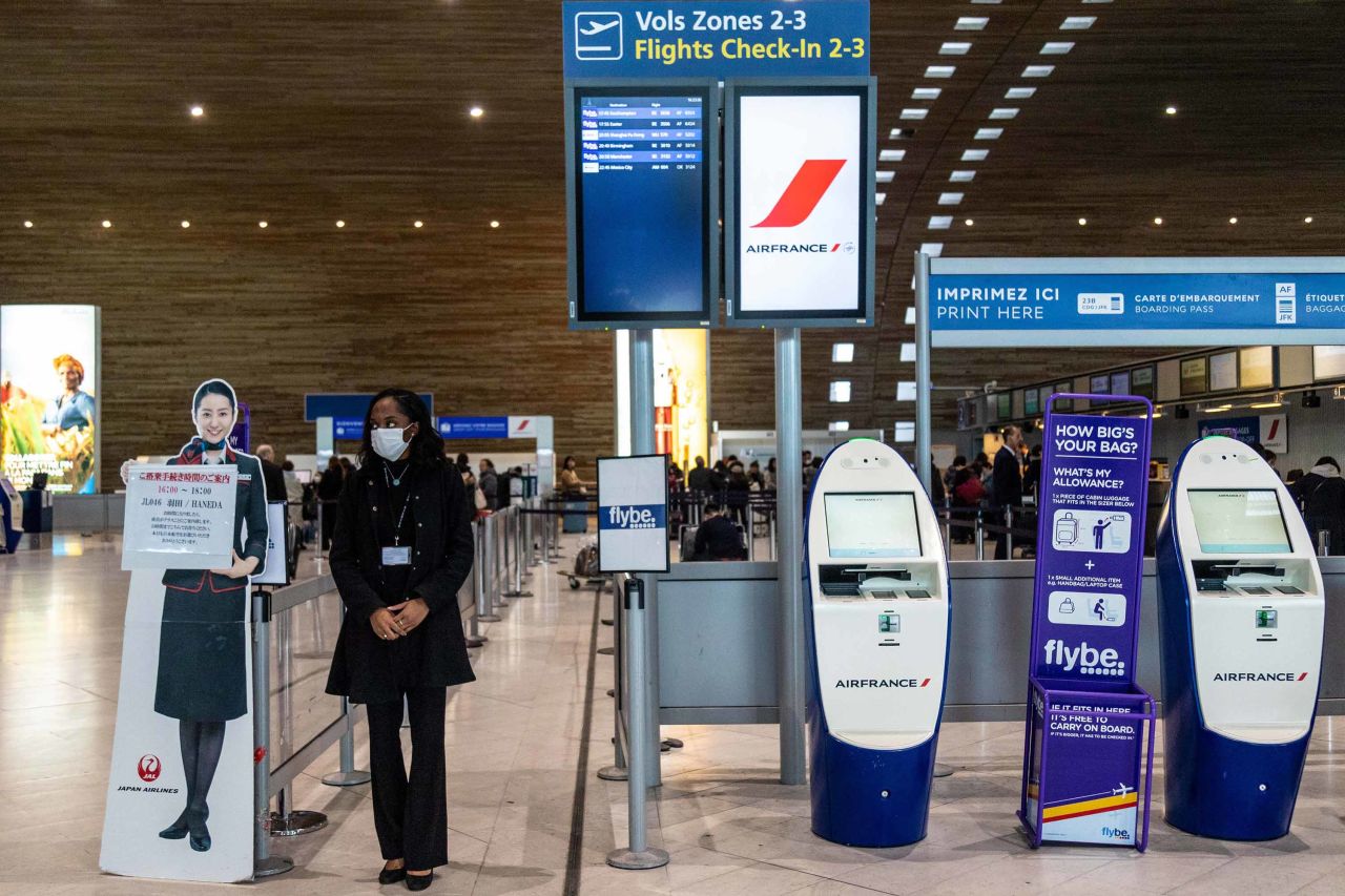 An employee stands at the Air-France KLM Group passenger check-in area at Charles de Gaulle airport in Roissy, France, on January 28.