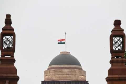 The Indian flag flies at half-staff at the presidential palace in New Delhi on Saturday)