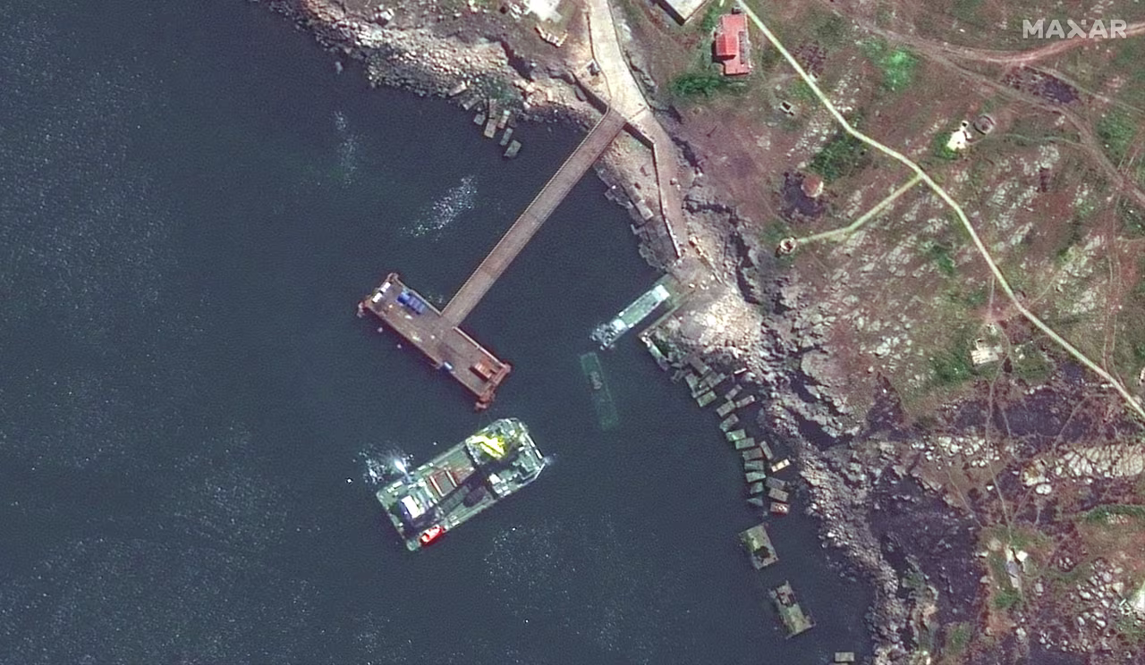 A Serna-class landing ship and another sunken vessel are seen near the Snake Island on May 12.