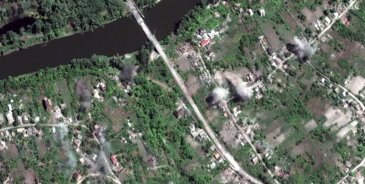 Smoke rises from explosions in the village of Bohorodychne.