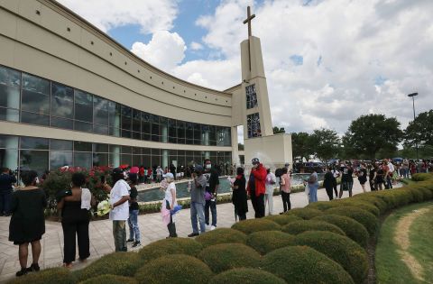 People wait in line to attend the public viewing for George Floyd outside the Fountain of Praise Church in Houston, Texas, on June 8.