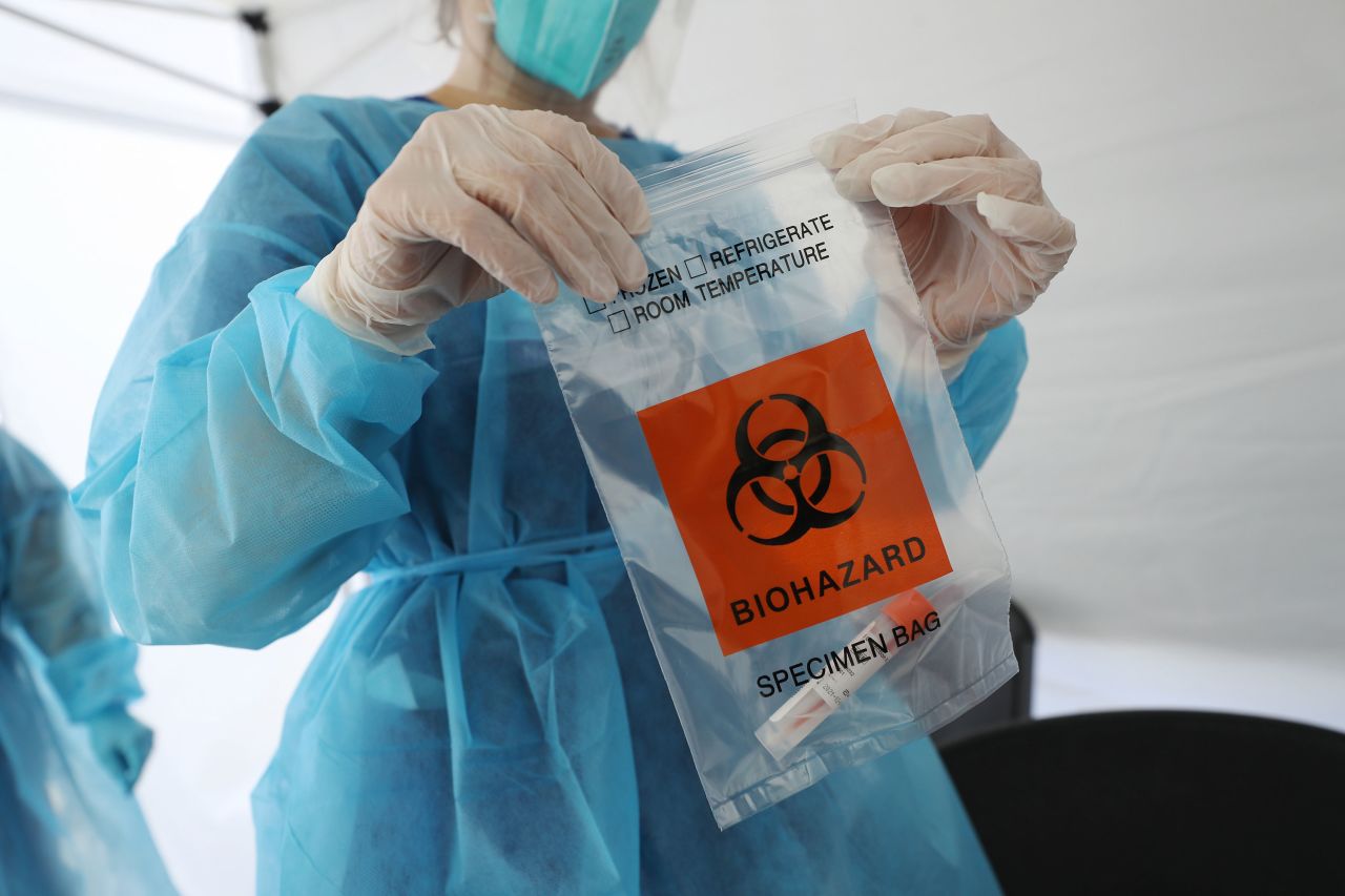 A nurse seals a specimen bag containing a Covid-19 test swab at a mobile clinic on July 15 in Los Angeles, California. 