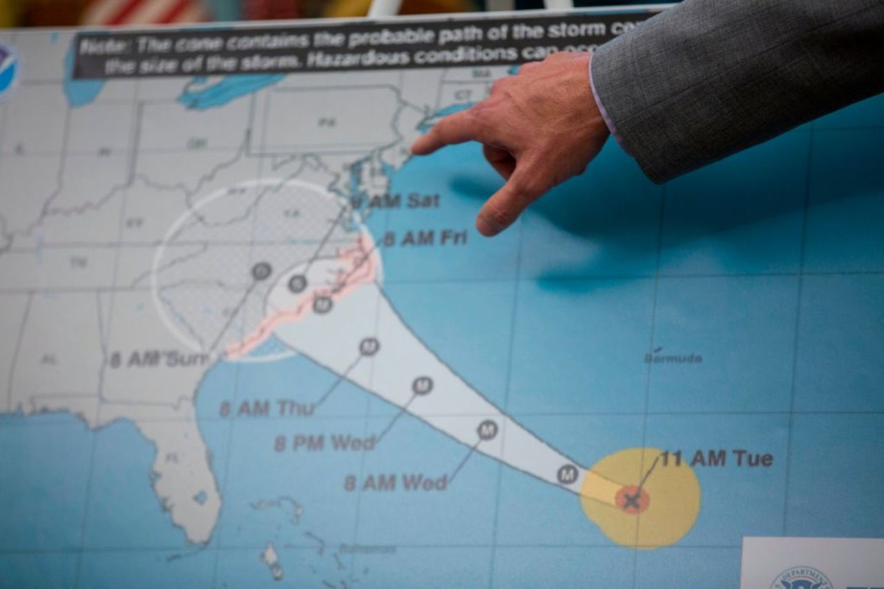 FEMA Administrator Brock Long points to a map after briefing President Donald Trump on Hurricane Florence in the Oval Office at the White House Sept. 11, 2018 in Washington, DC.