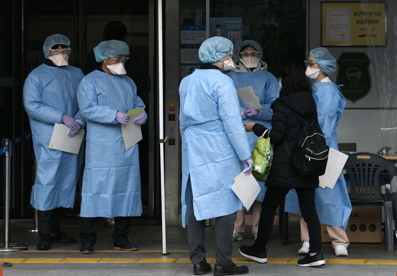 Medical officials in front of a hospital in Seoul on February 4, 2020.