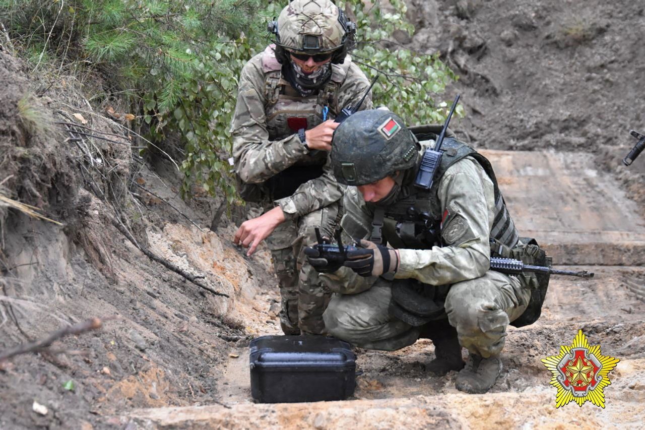 A fighter from Russian Wagner mercenary group and a?Belarusian service member take part in a joint training at the Brest military range outside Brest,?Belarus, in this still image from a video released on July 20.