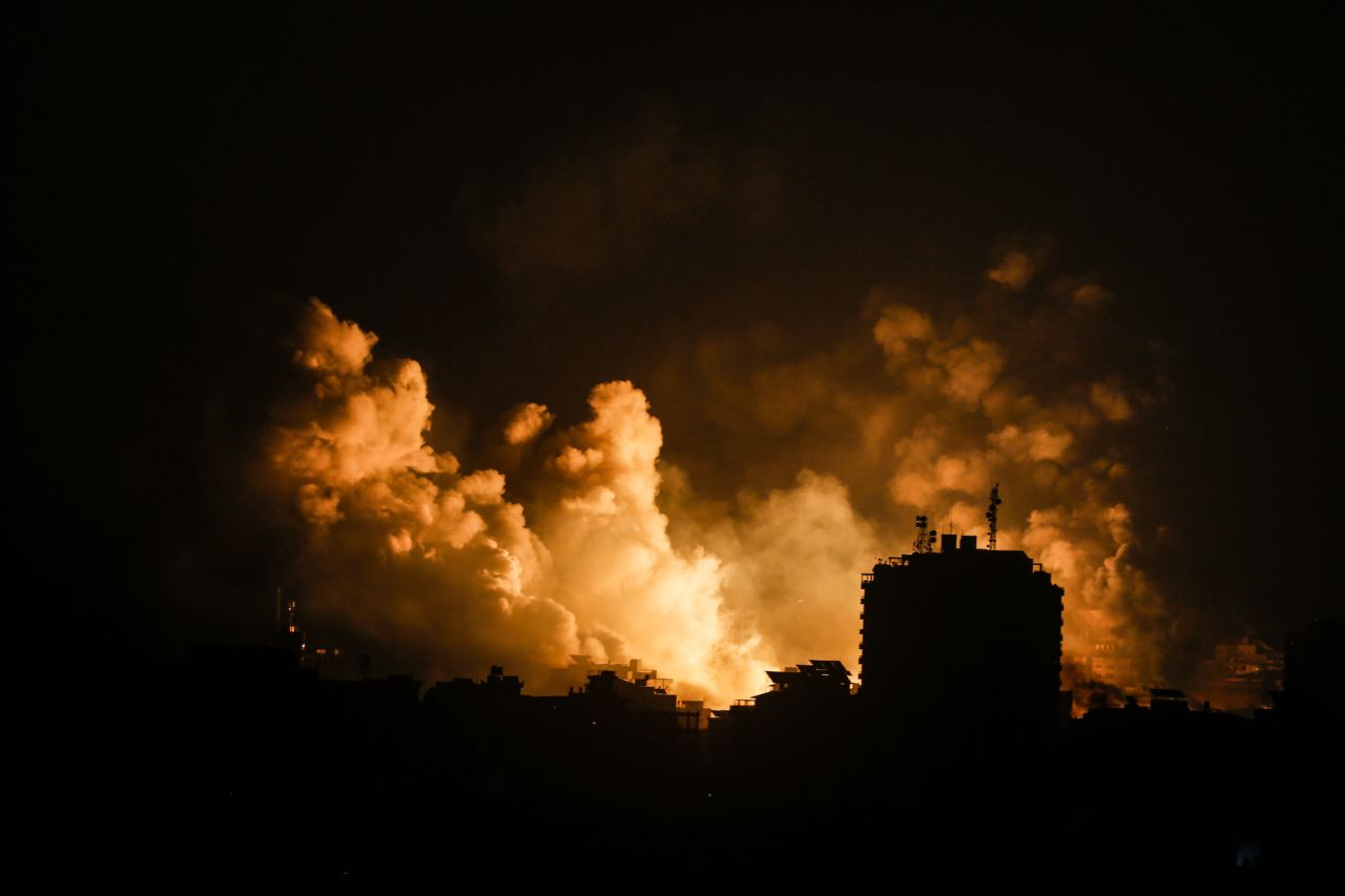 A ball of fire is seen over a buildings after an Israeli airstrike in Gaza City on Sunday.