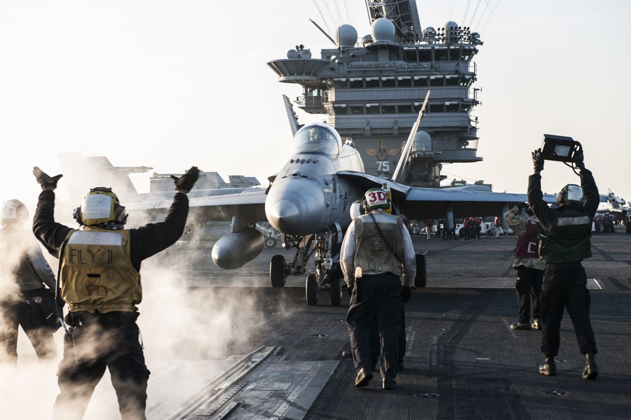 An F/A-18 fighter jet aboard a US aircraft carrier.