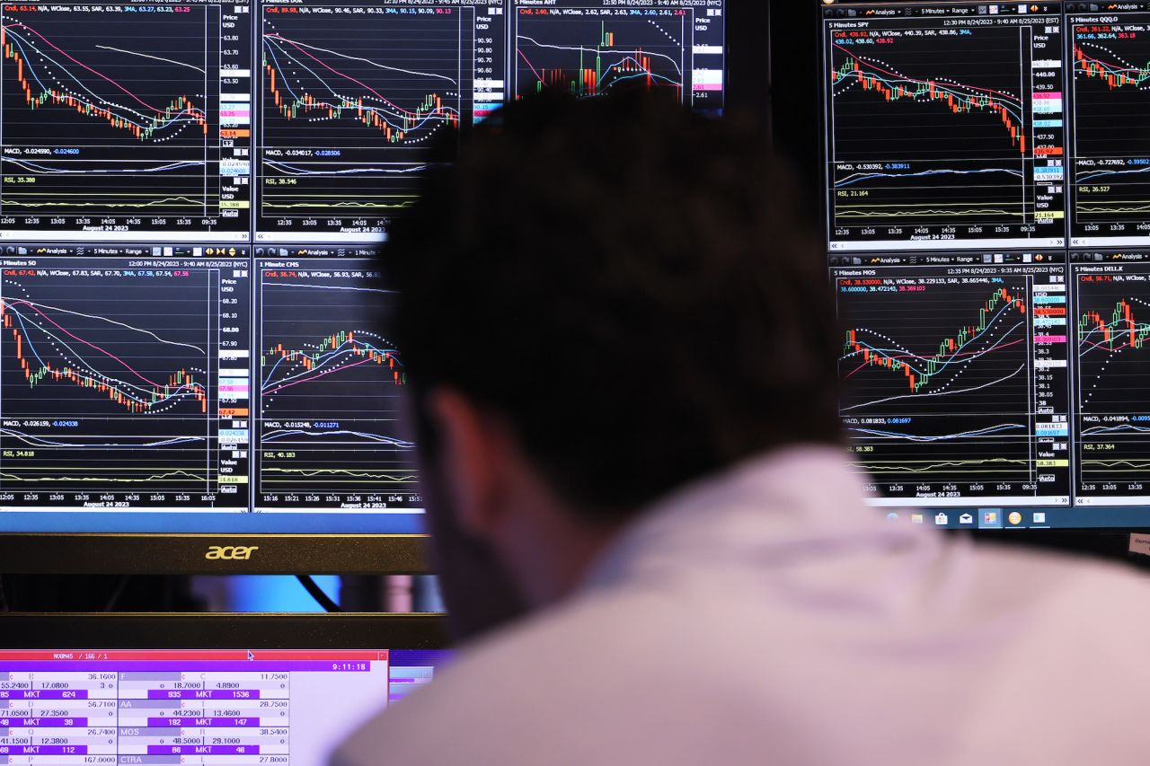 Traders work on the floor of the New York Stock Exchange during morning trading on Friday.