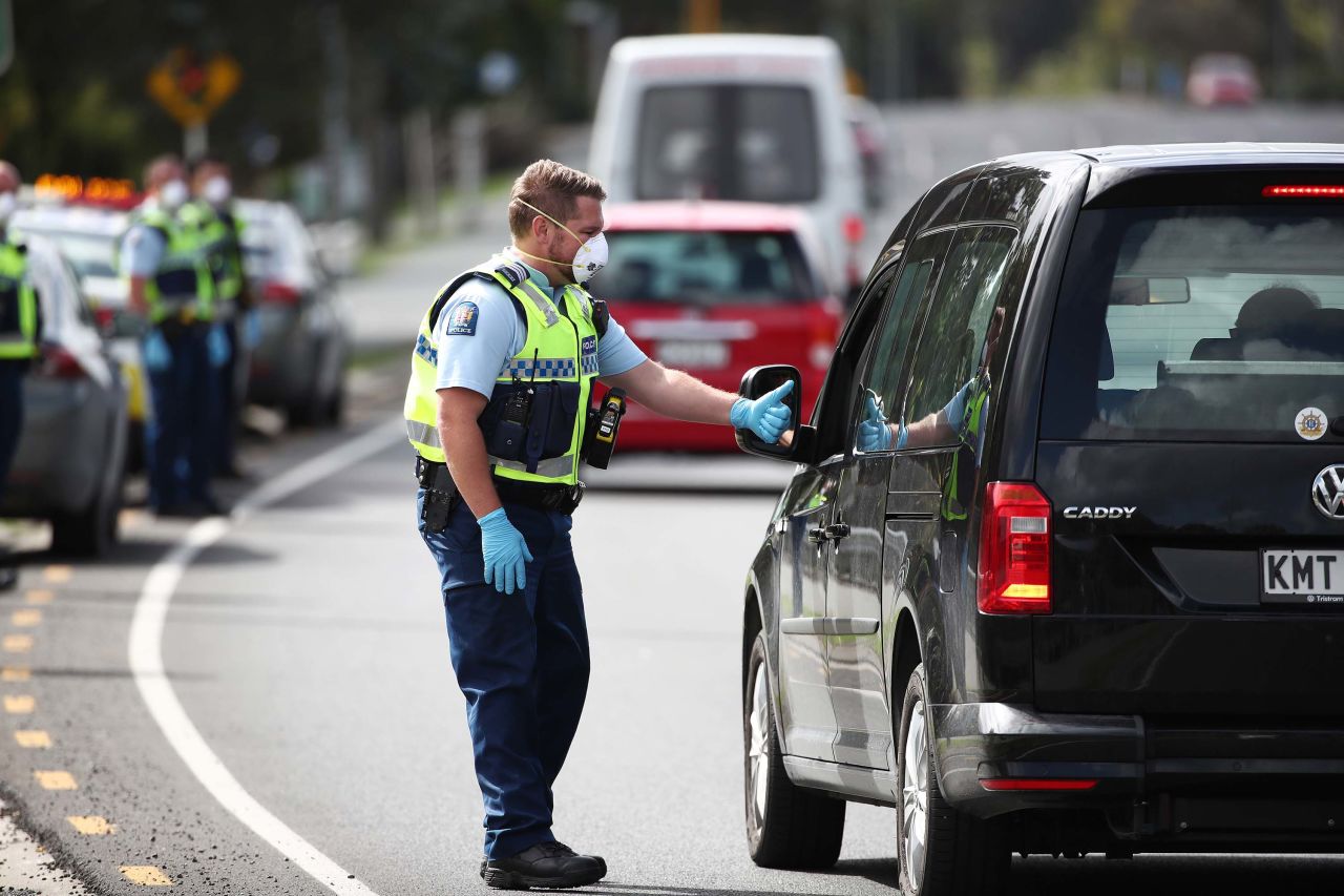 Police stop traffic during lockdown in Auckland, New Zealand, on April 9.