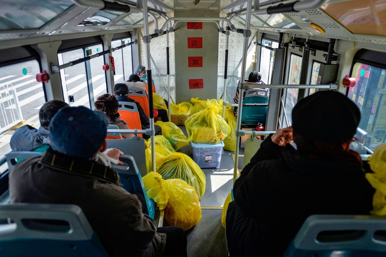 A group of people leave a hospital in Wuhan on Saturday after recovering from coronavirus.