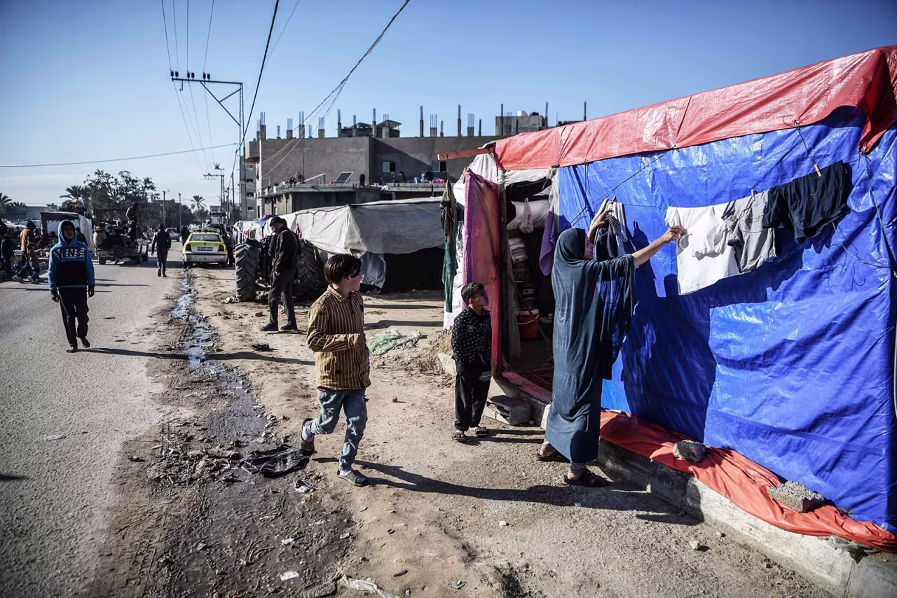 Displaced Palestinians are pictured along a road near their makeshift tent in Rafah, Gaza on February 4.