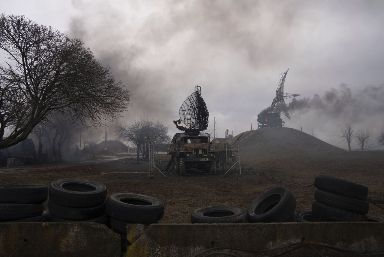 Smoke rises from a Ukrainian air defense base in the aftermath of an apparent Russian strike in Mariupol, on February 24.
