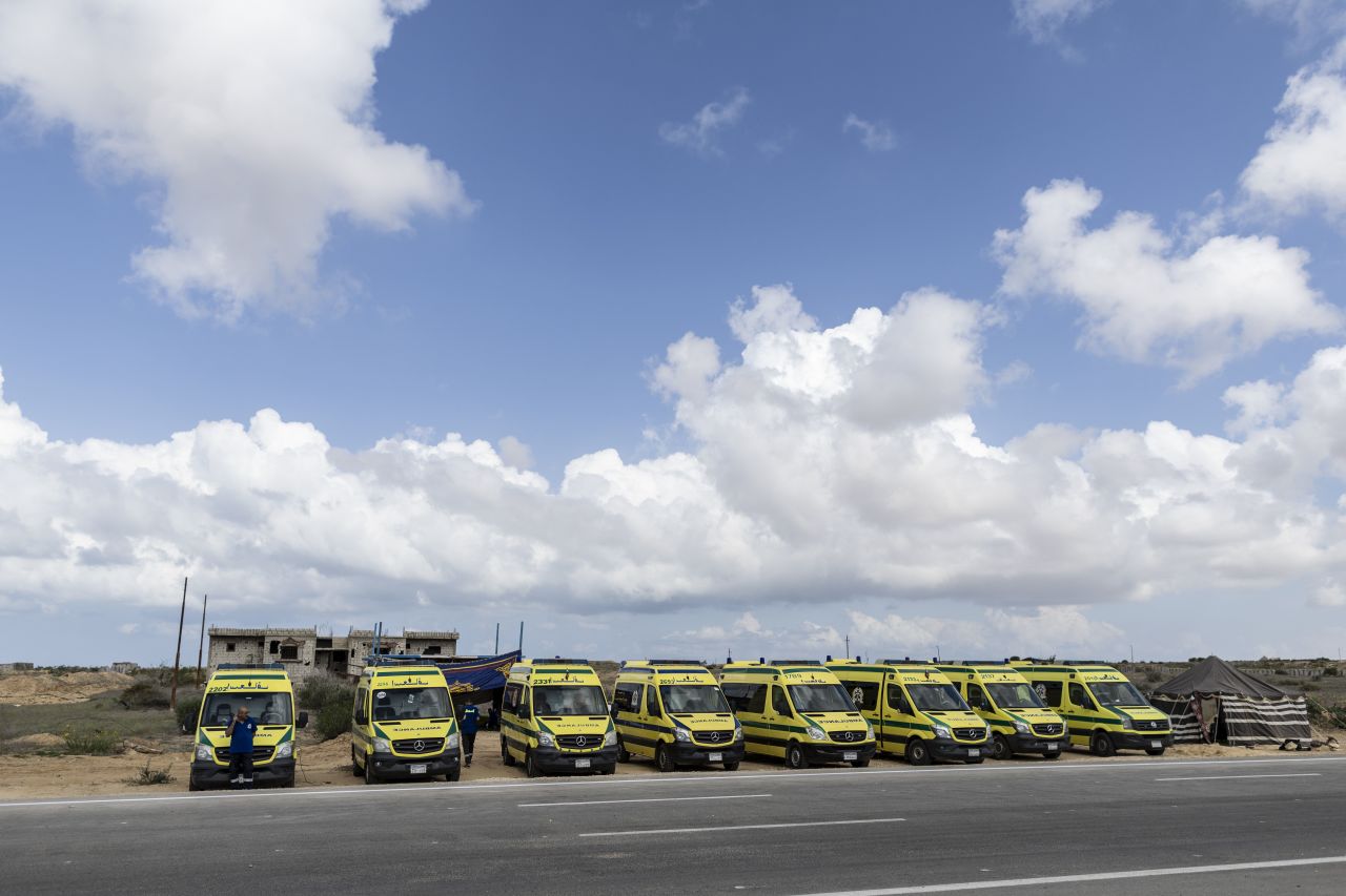 Ambulances are parked in Sheik Zwaid (5KM) from the Rafah border on October 18 in North Sinai, Egypt.