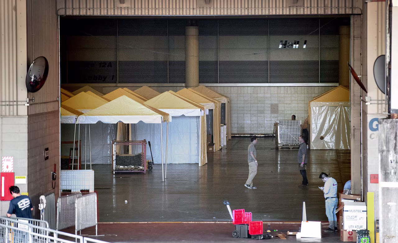 Workers convert the Ernest N. Morial Convention Center into a temporary hospital on Friday, March 27, in New Orleans, Louisiana.