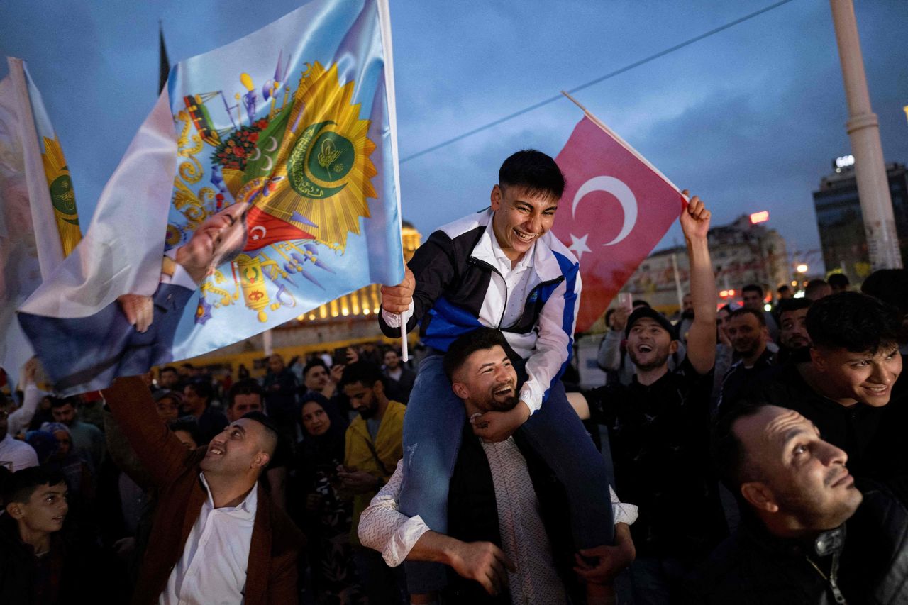 Supporters of Turkish President Recep Tayyip Erdogan celebrate in Istanbul's Taksim Square on May 28. 