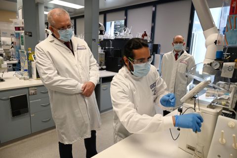 Australian Prime Minister Scott Morrison, left, takes a tour at the AstraZeneca laboratories in Sydney's Macquarie Park on Wednesday.