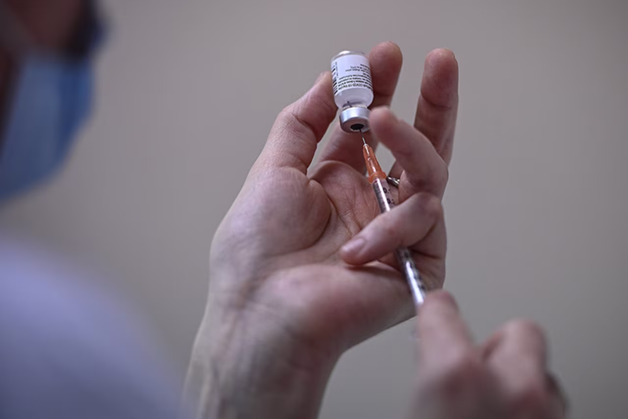 A nurse fills a syringe with a vial of the Pfizer BioNTech vaccine at the Pasteur Institute, in Paris, on January 21. 