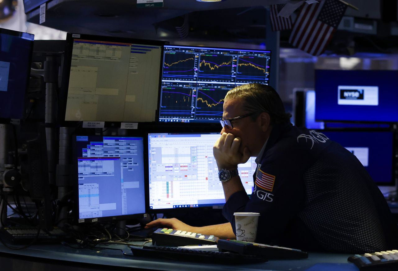 Traders work on the floor of the New York Stock Exchange on Wall Street on August 22.