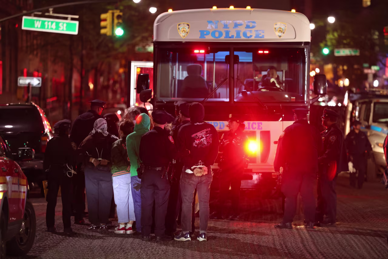 NYPD officers arrest people at Columbia University in New York on Tuesday. 