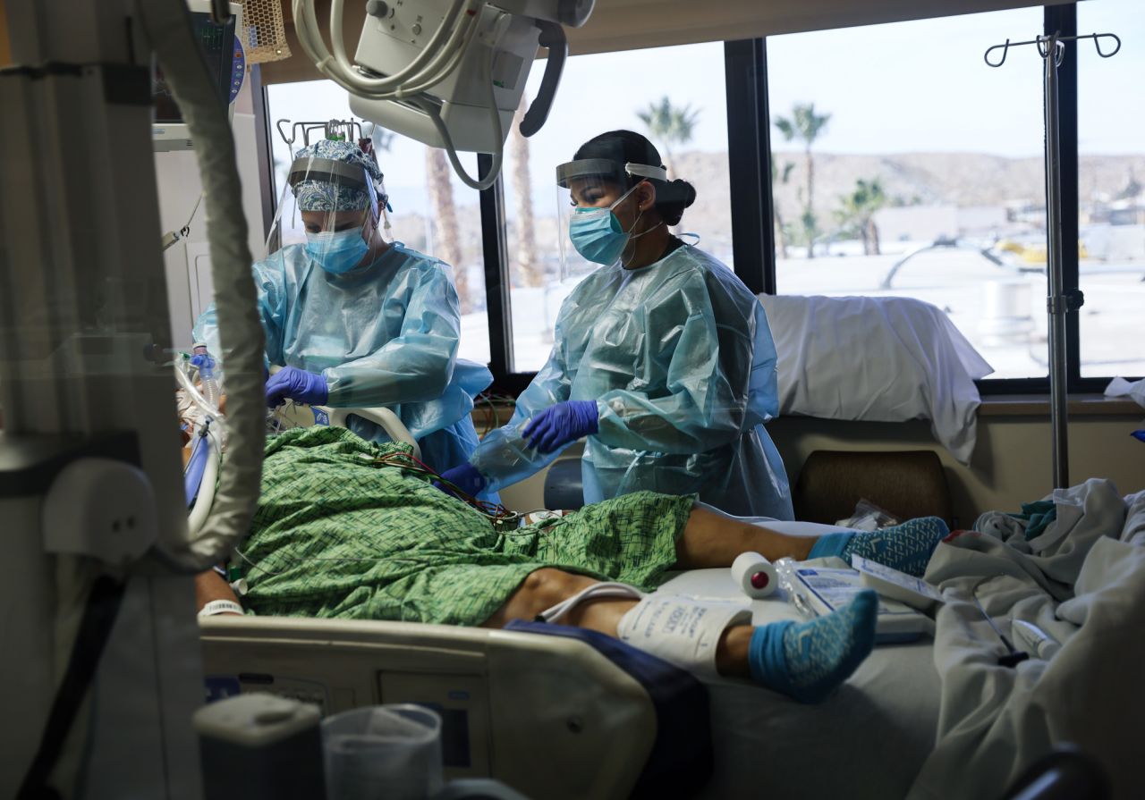 Clinicians care for a Covid-19 patient in the Intensive Care Unit at Providence St. Mary Medical Center on December 23, 2020 in Apple Valley, California. 