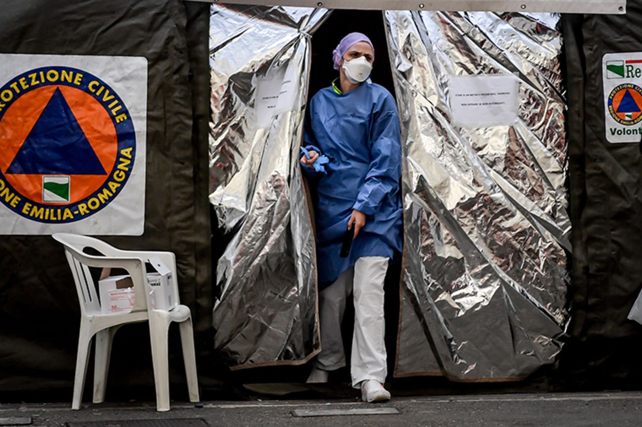  A paramedic wearing a mask exits a tent set up outside the emergency ward of the Piacenza hospital in Piacenza, Italy, on Thursday, February 27.