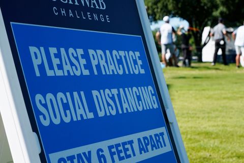 A sign at the 17th tee reminds players to practice social distancing during the first round of the Charles Schwab Challenge golf tournament at the Colonial Country Club in Fort Worth, Texas, Thursday, June 11. 