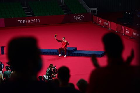 Denmark's Viktor Axelsen waves to the crowd during a medal ceremony on Monday. 
