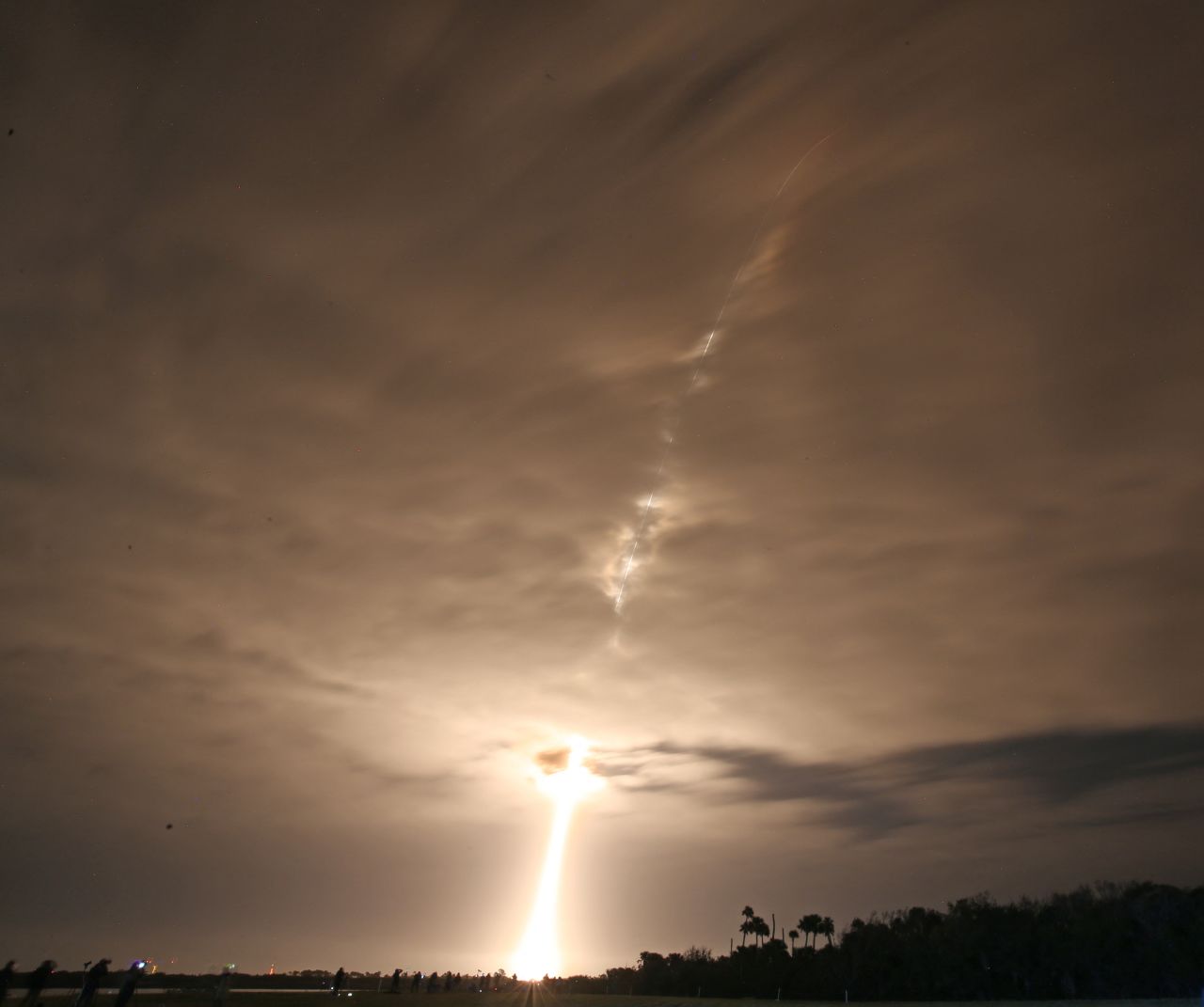 A SpaceX Falcon 9 rocket disappears into the clouds after lifting off at the Kennedy Space Center on NASA's PACE mission in Cape Canaveral, Florida, on February 8.